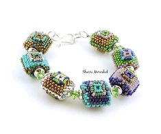 a bracelet with beads and charms on it