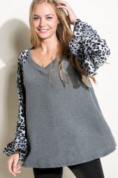 SOLID AND CHEETAH MIXED BLOUSE TOP- Solid and cheetah mixed blouse top- V neck- Ruffled bell long sleeve- Relaxed fit tunic length- Solid waffle jersey and woven animal print mixed- Model is 5' 8" 32-24-34 and wearing a Small- 80% POLYESTER, 16% RAYON, 4% SPANDEX- MADE IN U.S.A Style: Casual Print / Pattern: SOLID AND CHEETAH MIX Fit: Relaxed fit Neck Line: V neck Sleeve: Long Sleeve Lining: No Made In: United StatesFabric Contents: 80% POLYESTER 16% RAYON 4% SPANDEXNon-sheer fabricCare Instruct Cocktail Dress Curvy, Casual Cocktail Dress, 4th Of July Dresses, Mixed Models, Cocktail Dress Formal, Fitted Tunic, Curvy Swimwear, Romper With Skirt, Printed Sleeves