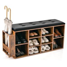 a wooden shoe rack with umbrellas and shoes on it's sides, holding several pairs of shoes