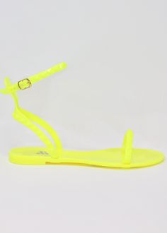 Aria Sandal - Women’s Flat Strappy Sandals in Neon Yellow. Lightweight, cute, and oh-so-comfortable. The flat, strappy Aria Neon Yellow Sandal is a travel essential and a staple of any fashionista’s closet. The best part? It’s completely waterproof, thanks to its jelly form. Take them all over the world—from the beaches of Mexico to the streets of Thailand. Or simply wear them with your favorite comfy outfit for a walk around your neighborhood! With its minimalist straps and compact design, the Best Travel Sandals, Travel Sandals, Yellow Sandals, Strappy Sandals Flat, Comfy Sandals, Mommy And Me Outfits, Jelly Sandals, Sandals Brands, Perfect Shoes