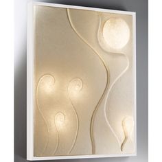 a white wall light with an abstract design on it