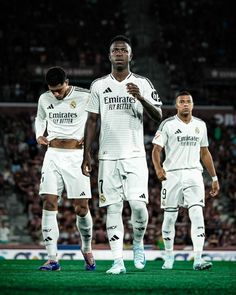 two soccer players are standing on the field