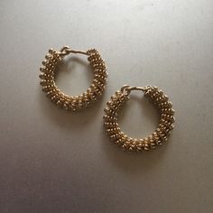 A pair of 1 1/4 inch (32 mm) diameter spiral brass temple rings. Based on an 11th century find from Poland. The basic ring is 16 gauge wire and the spiral wire is 20 gauge. Appropriate for Slavic reenactors. Worn on a band or woven into the hair. The perfect accessory for the Slavic woman. These give a bold impression, but they are light weight. Gold Spiral Wire Wrapped Hoop Earrings, Spiral Wire Wrapped Metal Hoop Earrings, Gold Spiral Brass Hoop Earrings, Wire Wrapped Metal Hoop Earrings, Spiral Gold Hoop Earrings In Brass, Spiral Brass Wire Wrapped Jewelry, Spiral Wire Wrapped Brass Jewelry, Temple Rings, Basic Ring