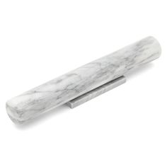 a white marble pen sitting on top of a desk