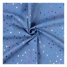 a blue fabric with multicolored dots on it