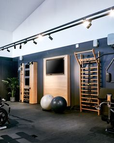 there is a gym with exercise equipment in the room and on the wall behind it