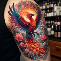 a colorful bird tattoo on the back of a woman's left arm and shoulder