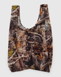 the camo shopping bag is made from realtreen and has an adjustable shoulder strap