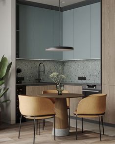 two chairs and a table in the middle of a room with wood flooring on the walls