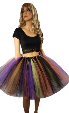 "Create your costume using this fluffy made to order witch tutu skirt. This skirt is made by tying strips of tulle to an elastic band and comes with a decorative satin black bow. The colors are Black, Orange, Purple, and Green Apple. Available in child and adult sizes. Child size 14 through adult sizes will be 20\" in length. Child sizes smaller than a 14 will be around knee length. Please message me before purchasing if you would like the skirt longer. Adults pick your size based on the size ch Fantasy Costume Black Skirt, Fantasy Black Skirt For Costume, Fantasy Skirt For Halloween Costume Party, Fairycore Costume For Halloween Cosplay, Fairycore Halloween Cosplay Costumes, Halloween Cosplay Mini Skirt, Fitted Halloween Costume Petticoat, Fitted Costume Petticoat For Halloween, Witchy Skirt For Halloween Cosplay