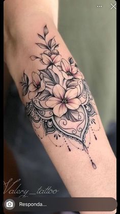 a woman's arm with flowers on it, and the words happy little responda