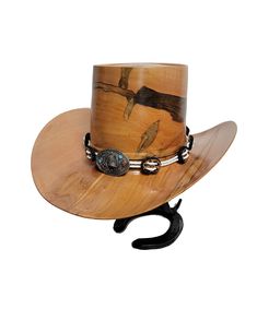 Beautiful wood-turned hat made from Ambrosia Maple signed and numbered by the artist, Brian Butler. Make a fashion statement in this unique hat! Measurements: Inside circumference: 22 inches Bill: 17.25" x 15" Height: 6.5" Weight: 3 lbs. ﻿Hatband and stand available for purchase separately. Brown Hat Bands For Western-themed Events, Unique Brown Hat Bands For Western-themed Events, Western Handmade High Crown Top Hat, Handmade Western High Crown Top Hat, Handmade Western Style High Crown Top Hat, Handmade Western Top Hat With High Crown, Artisan Brown Top Hat For Rodeo, Artisan Flat Brim Top Hat For Western-themed Events, Custom High Crown Top Hat For Country Events