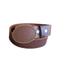 A classic brown leather belt buckle that will make any outfit stylish. The genuine leather buckle is designed on an antique brass finished oval buckle. Pair it with an interchangeable snap belt to style your outfit. The buckle can snap easily on and off to change the look of any outfit.  The belt is not included and may be purchased for an additional cost.  The buckle fits belts up to 1 1/2 inches or 38 mm wide.  The buckles are packaged in an organza bag which is great for gift giving or storing. Luxury Leather Belt Buckles With Belt Clip, Luxury Belt Buckles With Removable Belt For Business, Luxury Leather Belt With Removable Buckle, Luxury Brown Belt With Silver Buckle, Luxury Brown Belt Buckles With Brass Buckle, Luxury Leather Belt Buckles For Everyday, Luxury Brown Belt Buckles With Silver Buckle, Luxury Belts With Antique Buckle For Everyday, Luxury Belts With Brass Buckle