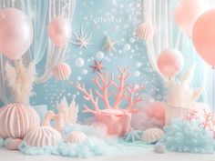 an ocean themed backdrop with pink and blue balloons, corals, starfish, seashells and other sea creatures