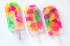 three popsicles with gummy bears on them and the words spirit and gummy bears