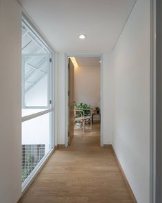 an empty hallway leading to a dining room