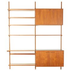 the shelving unit is made out of wood and has three shelves on each side