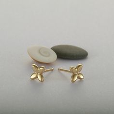 These are flower stud earrings, handmade of yellow 14k solid gold.  Their finish is shiny, and they are comfortable to wear. Small and dainty, these unique gold studs are perfect for everyday's wear.  Great as a gift as they can be enjoyed at any age and outfit. 14k solid gold ear backs are included. Size of the earrings is 5.3 x 5.8 mm = approx. 0.2 x 0.22 inch * The earrings will be packed in a gift box ready to give as a gift, and shipped via Express mail service which usually takes 4-6 busin Gold Flower Stud Earrings, Yellow Gold Hallmarked Flower Earrings For Gift, Yellow Gold Flower Shape Cluster Earrings For Gift, Yellow Gold Flower Cluster Earrings Gift, 14k Yellow Gold Cluster Earrings Gift, Real Gold Earrings, Unique Stud Earrings, Stud Earrings Unique, Studs Gold