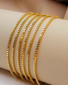 "--- Created in GURANTEED HIGH QUALITY 18-Karat SOLID GOLD --- Not Gold Filled or Plated! At a 2 millimeter thickness this chain is available in 16\" to 26\" lengths. 16 inches - 2 mm : 4.42 gr (grams weight) 18 inches - 2 mm : 4.97 gr 20 inches - 2 mm : 5.57 gr 22 inches - 2 mm : 6.10 gr 24 inches - 2 mm : 6.29 gr 26 inches - 2 mm : 6.81 gr Closure: Lobster Claw ( Strong and Durable ) Chain style: 18K Gold Box Chain Please feel free to message me for any custom sizing! * A gold Box chain necklace is an accessory that instantly takes your style to the next level; Wear it all day, Everyday. it's also very study to hold your favorite pendant or ring! Gift for him, birthday, anniversary, Christmas gift! * 18k solid gold pieces are made to last forever. Solid 18K gold jewelry is the most expen 22k Gold Box Chain Jewelry Gift, Gold 22k Box Chain Necklace, Mens Chain Designs, 14k Gold Jewelry With Box Chain In Gold-tone, Luxury Gold-tone Box Chain Bracelets, Hand Jewelry Rings, Luxury Gold-tone Brass Chain Necklace, Gold Earrings Wedding, Antique Gold Jewelry