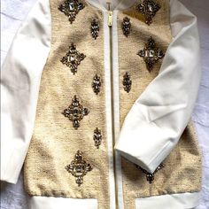 This Is Such A Lovely Jacket By Ted Baker. This Bomber Styled Jacket Is Decorated Embellished With Crystal Stones To Make This Jacket Elegantly Sparkle . This Eye Catching Jacket Has Hints Of Gold And Natural Burlap Color Complemented By Ivory Tones. Gently Used Once , Perfect To Make Any Outfit Stand Out. Open To Offers Spring Embellished Gold Outerwear, Embellished Gold Outerwear For Spring, Gold Embellished Outerwear For Spring, Ted Baker Jacket, Embellished Jacket, Color Complement, Flower Embroidery Designs, Crystal Stones, Flower Embroidery