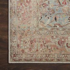 an antique rug on a wooden floor