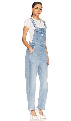 Find LEVI'S Vintage Overall In Denim-light on Editorialist. LEVI'S Vintage Overall in Denim-Light. - size M (also in L, S, XL, XS) LEVI'S Vintage Overall in Denim-Light. - size M (also in L, S, XL, XS) 100% cotton. Made in China. Machine wash. Pull-on styling. 5-pocket styling. Adjustable shoulder straps. LEIV-WC17. 85315-0016. Levi Strauss & Co., established in 1853, is a brand with a loyal, worldwide following. Their innovation with the co-invention of the blue jean was an integral part in cre On Hiatus, Levi Strauss & Co, Blue Jean, Levi Strauss, Vintage Levis, Shoulder Straps, Blue Jeans, Sustainability, Jumpsuit Romper