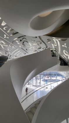 the interior of a modern building with an artistic design on it's walls and ceiling