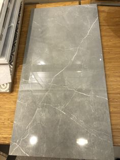 a marble counter top sitting on top of a wooden table