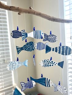 a mobile made out of blue and white fish