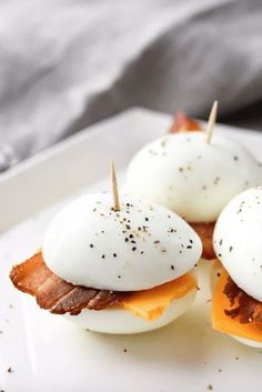 bacon and eggs are topped with melted cheese on toasted buns for an easy appetizer