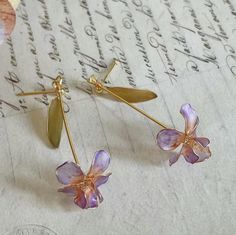 Discover the enchanting beauty of our Resin Iris Earrings, These exquisite long flower earrings are not just a piece of jewelry; they're a celebration of elegance, making them an ideal choice for bridal wear or a thoughtful Mother's Day gift. Each pair is delicately crafted, embodying the essence of spring and renewal, perfect for teachers, brides, or anyone looking to add a touch of floral grace to their ensemble.  . . . . . . . . . . . . . . . . . . . . . . . . . . . . . . . . . . . . Personal Iris Jewelry, Jewelry Flower, Personalised Gift Boxes, Purple Iris, Floral Jewelry, Girlfriend Birthday, Bridal Shower Gift, Resin Earrings, Floral Jewellery