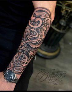 a man with a tattoo on his arm