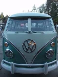 an old vw bus is parked on the street