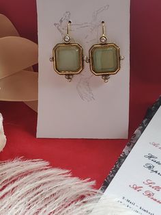 I saw these earrings and knew they were perfect to offer in the shop.  They are gold plated earwires with a square glass green intaglio and pearl elements.  Perfect to wear for late 18th century, early 19th century on up to today.  I love them! They measure 1-1/4 inches long by just over 1/2 inch wide.  The earwire is super long which is good to stay in the ear. Lots of inspiration on my Pinterest page.  https://www.pinterest.com/kkwalte/_saved/ Formal Brass Plug Earrings, Gold Rectangular Earrings For Gift, Rectangular Brass Jewelry Gift, Antique Gold Pierced Earrings For Formal Events, Antique Gold Pierced Earrings For Formal Occasions, Nickel Free Rectangular Gold Earrings, Gold Brass Rectangular Earrings, Nickel-free Rectangular Gold Earrings, Gold Rectangular Brass Earrings