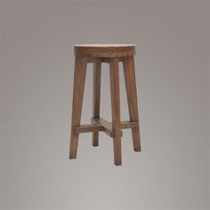 the stool is made from wood and has two legs that are bent down to one side