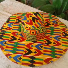 African Print Colorful Wide Brim Sun Hat For Vacation, Colorful Curved Brim Sun Hat For Vacation, Colorful Sun Hat For Vacation, Yellow Bohemian Wide Brim Straw Hat, Yellow Bohemian Straw Hat With Curved Brim, Multicolor Flat Brim Hat For Vacation, Colorful Wide Brim Vacation Hats, Bohemian Yellow Wide Brim Sun Hat, Yellow Bohemian Wide Brim Sun Hat