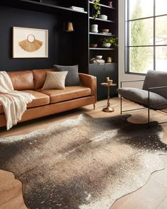 a living room filled with furniture and a brown rug