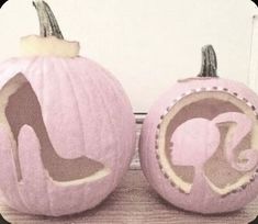 two pink pumpkins with high heel shoes on them