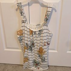 Nwt Maurice’s Tank Top, Sleeveless Shirt. Size Xl. Very Stretchy. From Shoulder To Front Bottom, 26” From Shoulder To Bottom Of Back 34” (For My Reference: 1066) Casual Floral Print Sleeveless Tank Top, Summer Beach Tops With Wide Straps, Floral Print Tank Top For Vacation, Stretch Sleeveless Blouse Tank Top For Vacation, White Casual Camisole With Wide Straps, Casual Floral Print Camisole Tank Top, Stretch Floral Print Summer Tank Top, Summer Floral Print Sleeveless Tank Top, White Tank Top With Wide Straps For Summer