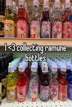 there are many bottles on the shelf in this store and one is labeled collecting ramune bottles