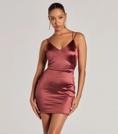 Bring all the iconic vibes in this satin mini dress to school dances or dressy birthdays! The spaghetti straps, and V-neckline with padded bra cups flatter while the bodycon silhouette accentuates your figure. With a sexy lace-up back and a mini-length hem, this dress is perfect for a night out. Complete the look in block heels and earrings!Fit & FeaturesSatin fabric, bust knit lining, minimal stretchSpaghetti strapsV-necklinePadded bra cupsLace-up backBodycon silhouetteRuns true to size Satin V-neck Mini Dress For Prom, Trendy Mini Prom Dress, Stretch Satin Mini Dress For Date Night, Spring Stretch Satin Mini Dress, Spring Satin Stretch Mini Dress, Satin Stretch Dress With Spaghetti Straps, Satin Finish Mini Dress For Date Night, Flirty Satin Stretch Mini Dress, Flirty Stretch Satin Mini Dress