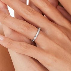 a woman's hand with a ring on it