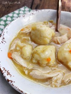 a white bowl filled with chicken and dumplings