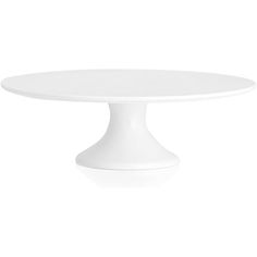 a white cake plate sitting on top of a table