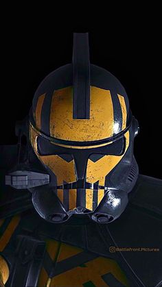 a helmet with yellow and black stripes on it