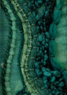 close up view of green and blue yarn