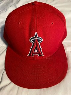 Selling is a new 59Fifty, Los Angeles Angels size 8 fitted red baseball cap.  Please see photographs provided for more information for this product.  The stock number for this product is 1046-0919-005 Classic Red Baseball Cap For Sports Events, Classic Red Baseball Cap, Classic Red Snapback Baseball Cap, Classic Red Baseball Cap With Flat Brim, Red Flat Cap Fitted Hat For Streetwear, Red Flat Cap For Baseball Season, Red Sports Fan Fitted Cap, Red Fitted Cap For Baseball Season, Red Fan Merchandise Fitted Cap