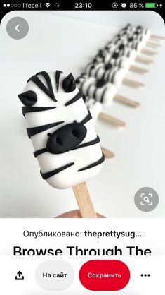 an image of a cake on a stick with zebras in the background and text that reads, brows through the photos