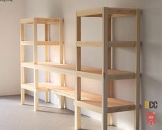 a wooden shelf sitting in the corner of a room next to a wall with shelves on it