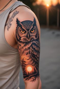 an owl tattoo on the left arm and shoulder is lit by the sun in the background